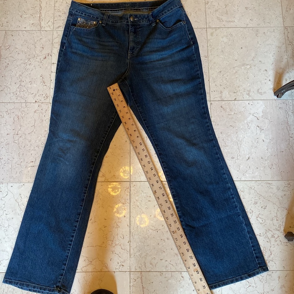 Medium wash jeans with bling on front pocket and both back pockets.